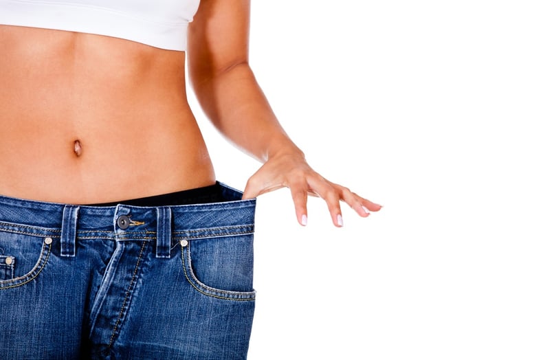 Thin woman in big pants - weight loss concepts.jpeg